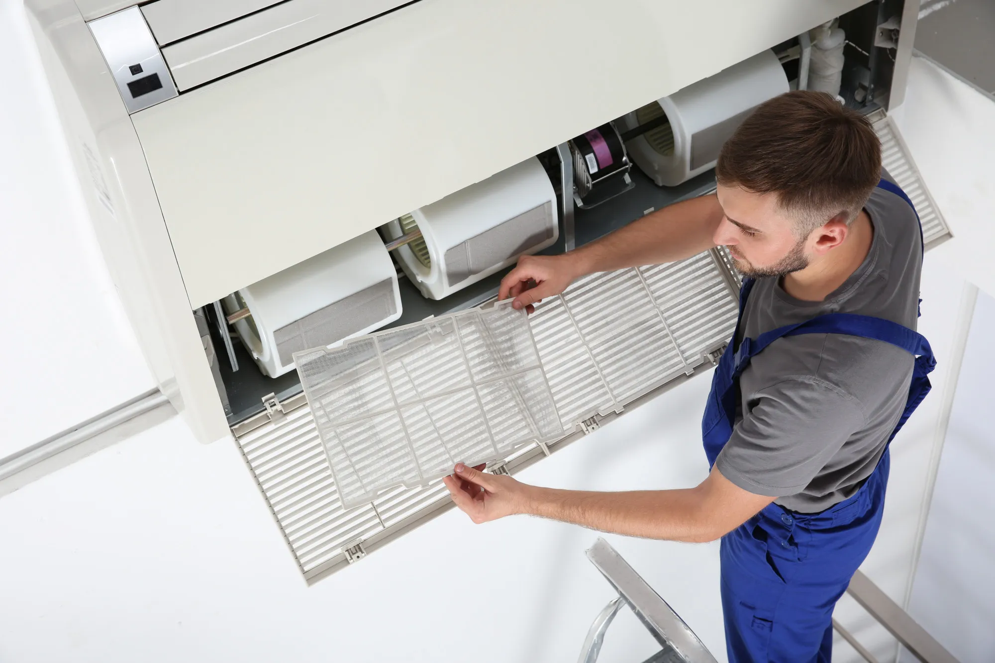 Emergency AC repair service fixing a broken cooling system in Las Vegas.