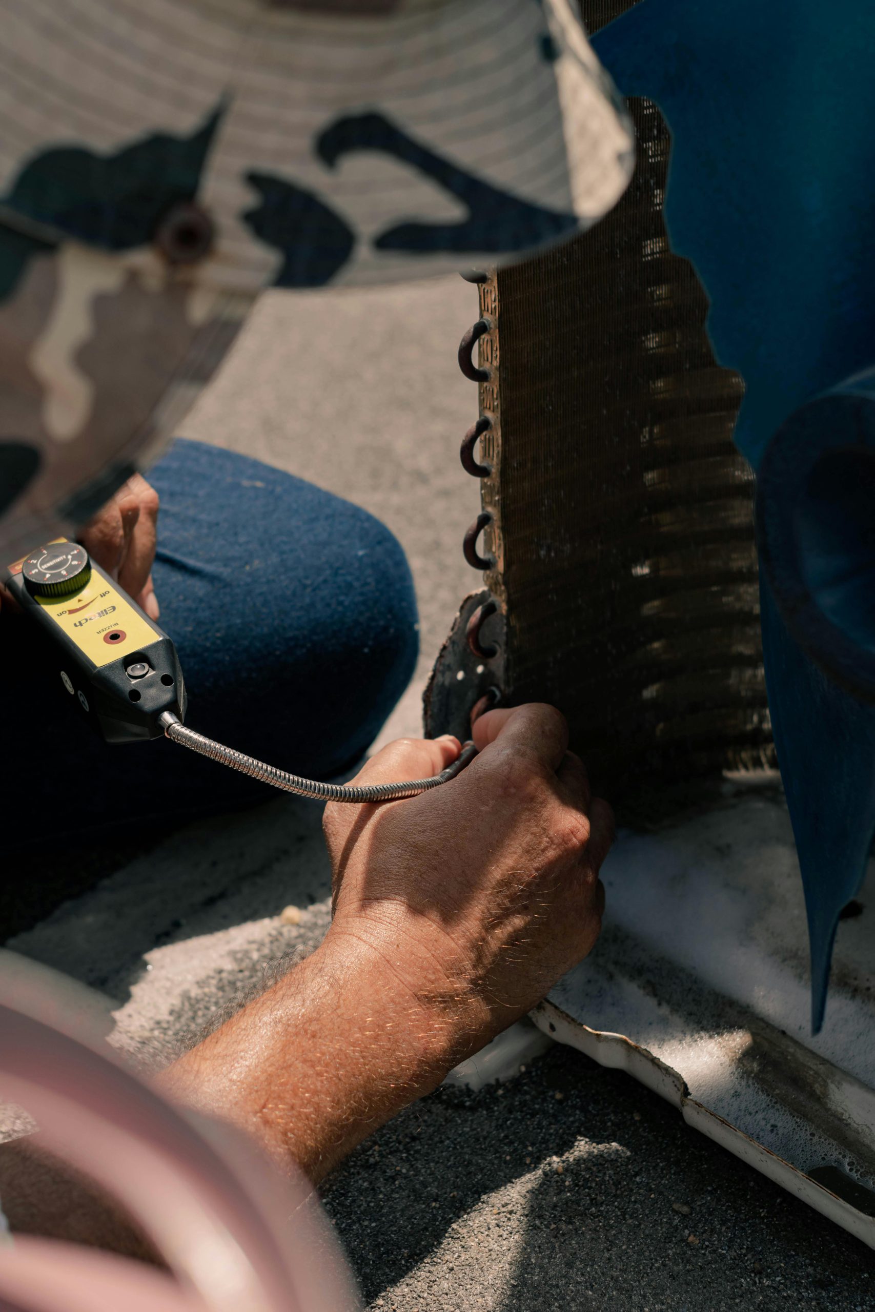 Emergency AC repair service fixing a broken cooling system in Las Vegas.