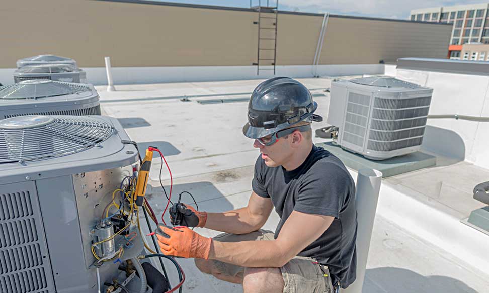 Professional installing a new AC unit in a residential home in Las Vegas.