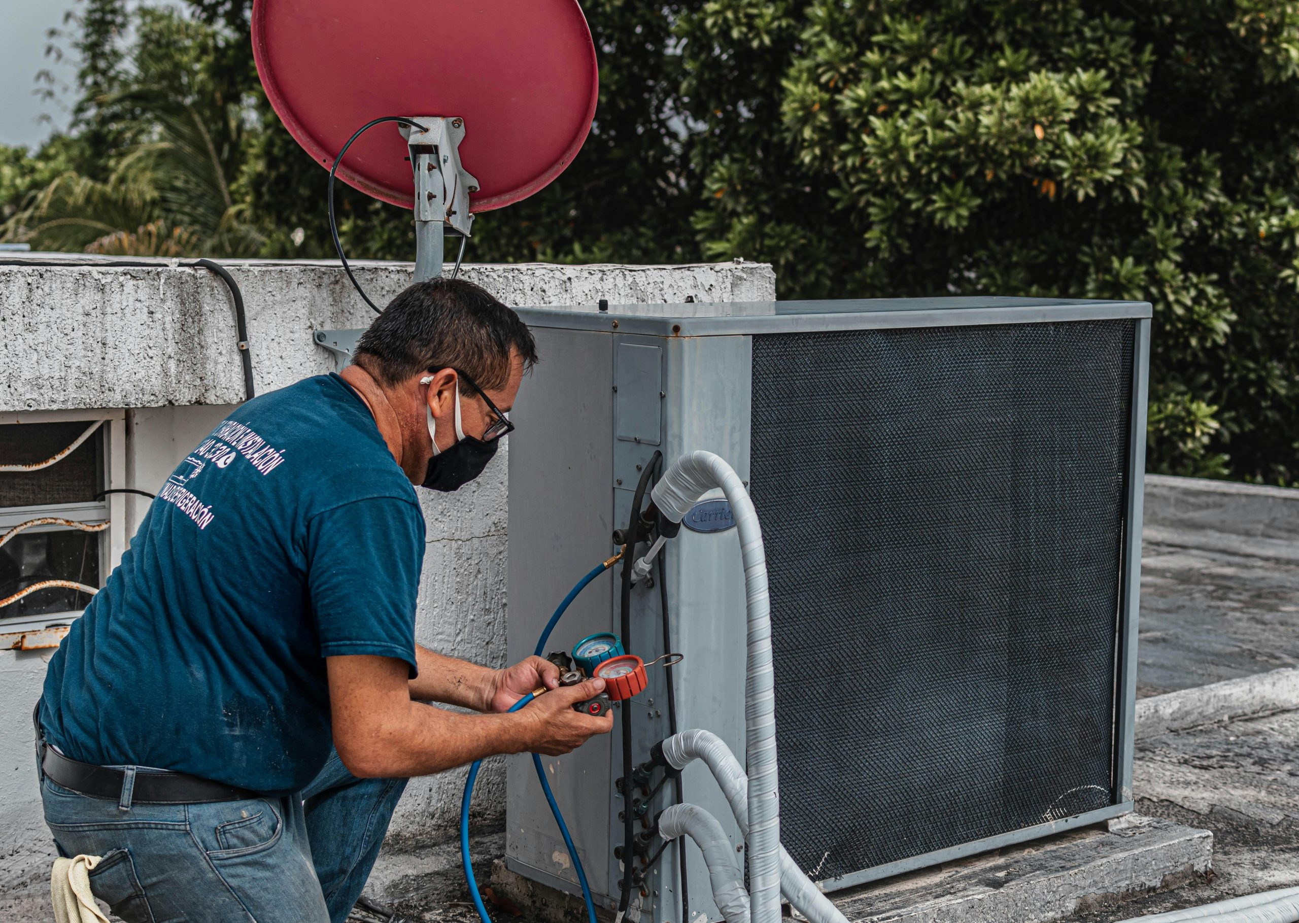 Green Air technician providing heating and cooling solutions for a customer.