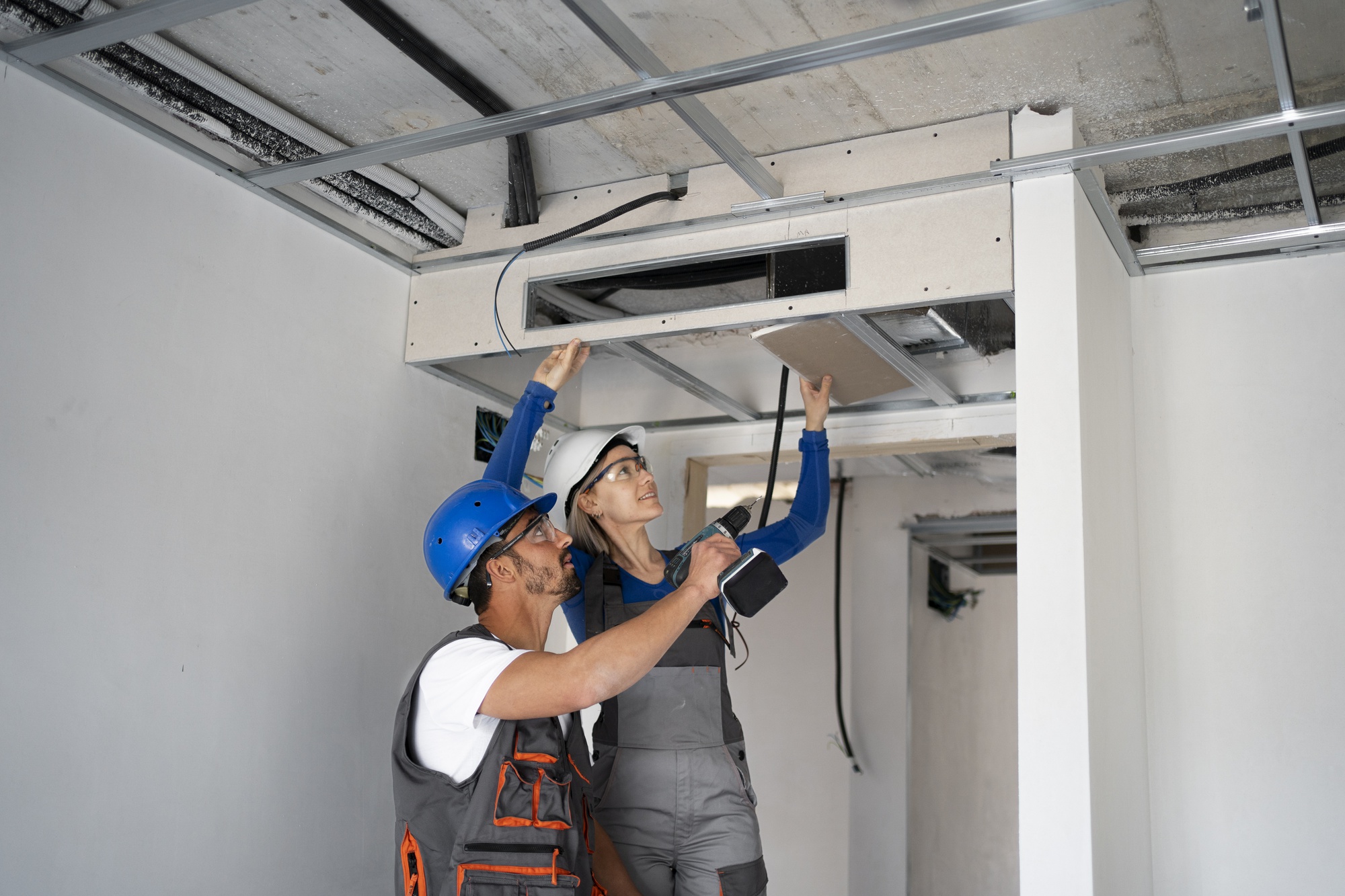 Technician inspecting an HVAC system for routine maintenance.