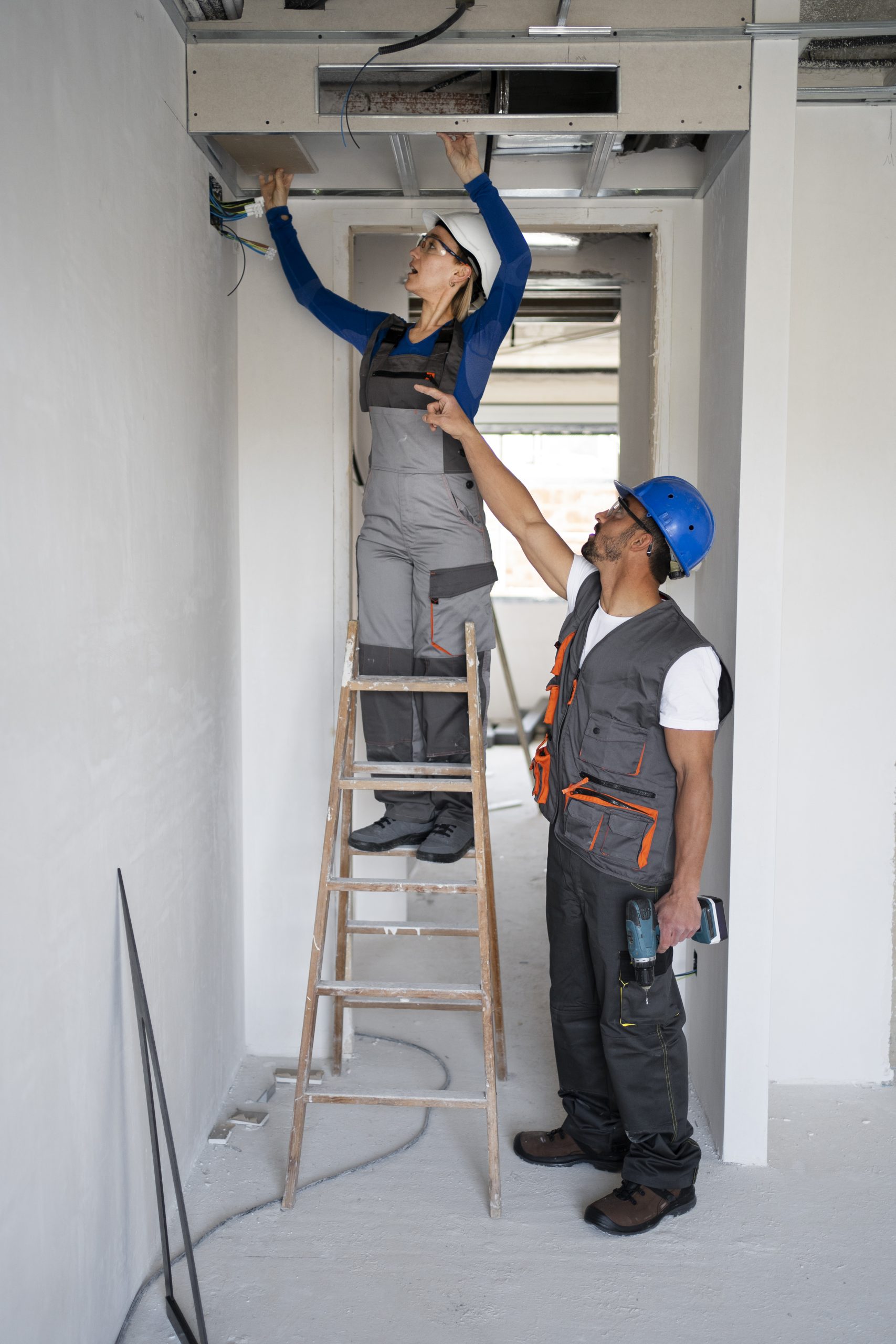 HVAC specialist installing a new air conditioning unit for a homeowner