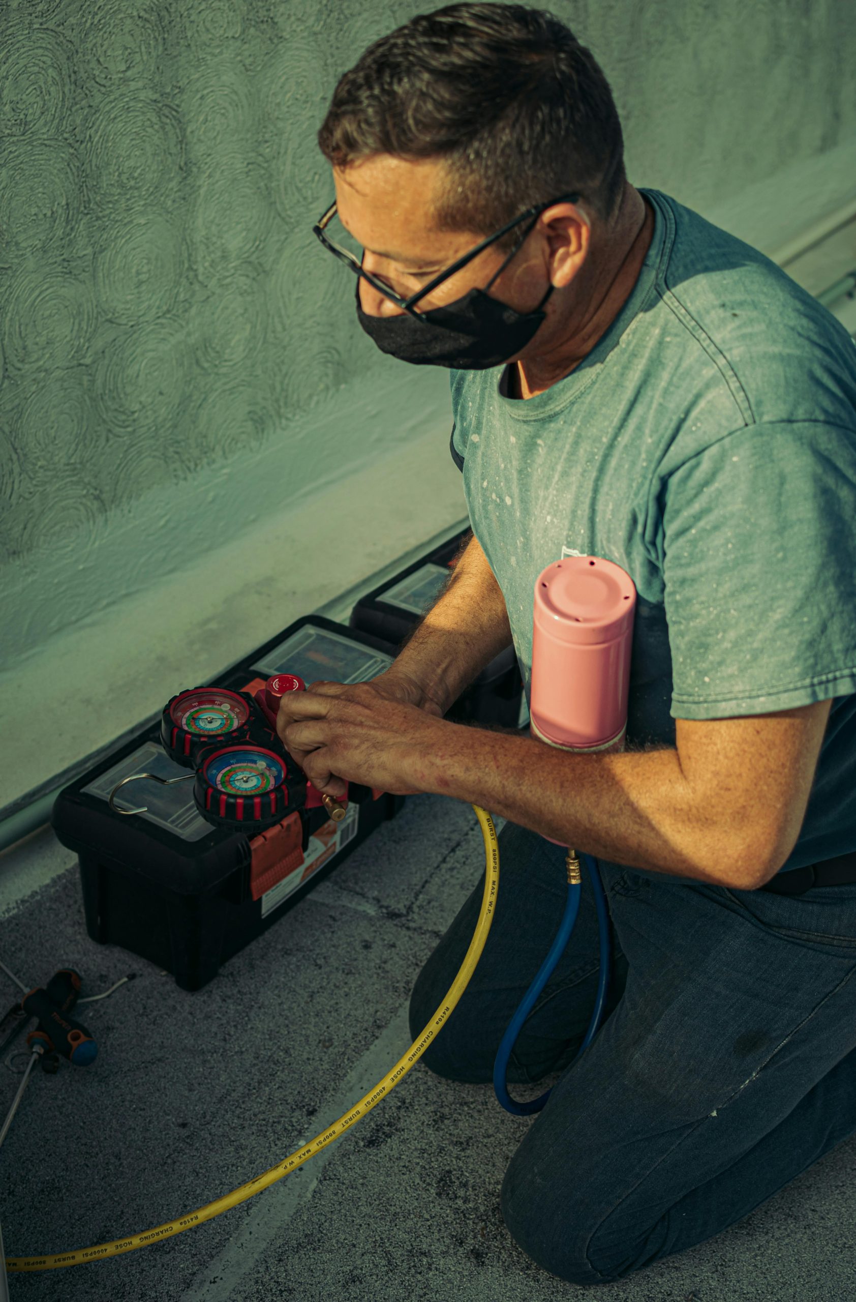 HVAC specialist installing a new air conditioning unit in a residential property.