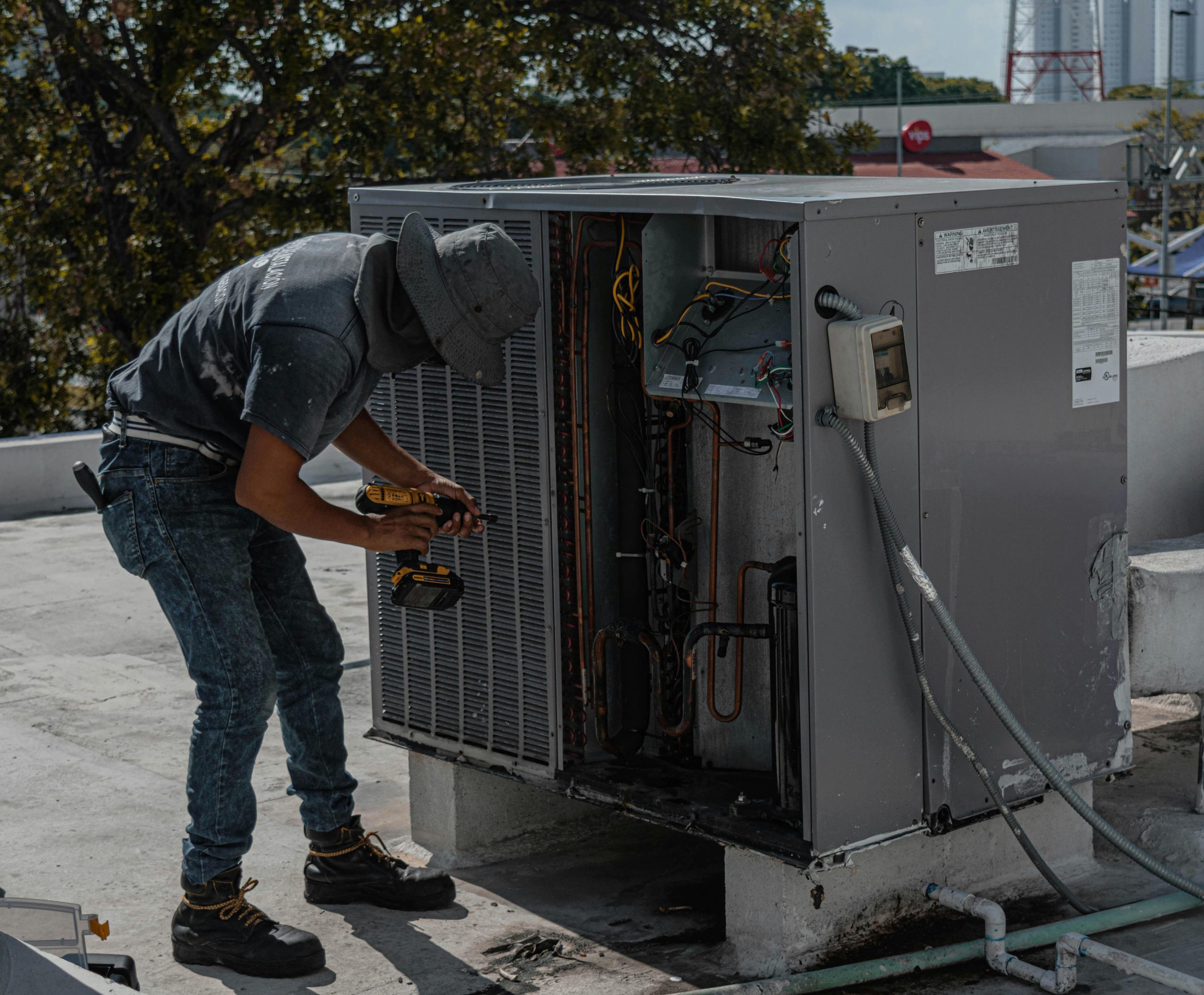 Furnace repair expert replacing damaged heating components.